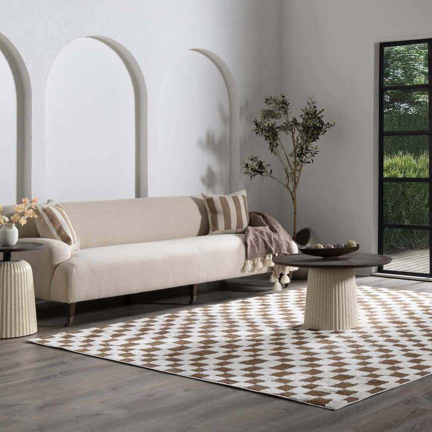 Living room scene with a brown and white checkered Keesa Area Rug, beige sofa, and modern decor. Roomscene-Rectangle
