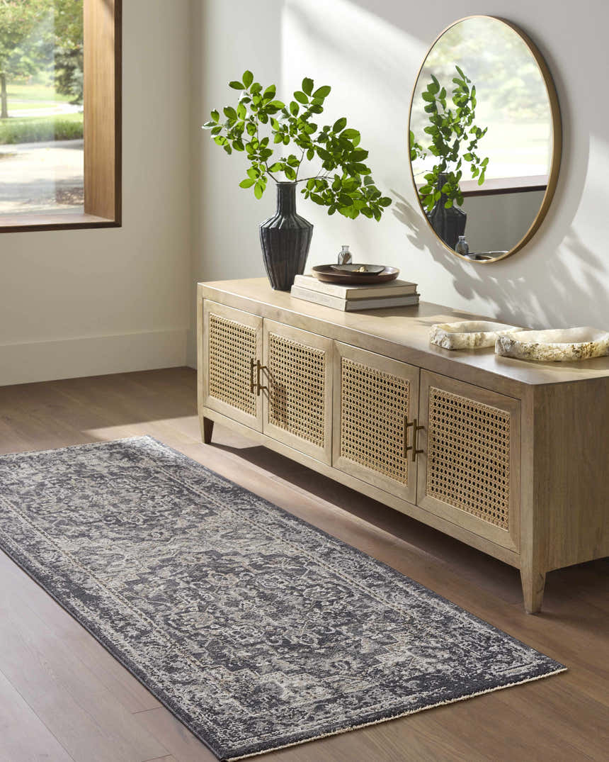 Entryway with Alissa Black Area Rug, wood floors, and a console table with a round mirror. Roomscene-Runner