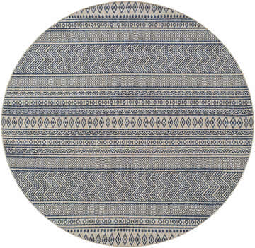 Close-up of a round Madras Ink All Over Performance Rug. Features a geometric, tribal-inspired pattern in ink and natural gray. Design-Round-67