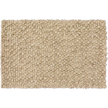 Close-up of the hand-loomed Dalyn Gorbea GR1 Latte Area Rug. Features a textured, looped wool design in neutral latte tones.