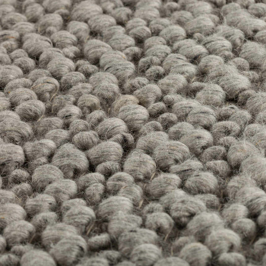 Close-up of the hand-loomed Dalyn Gorbea GR1 Silver Area Rug, showing the wool texture and silver gray color.