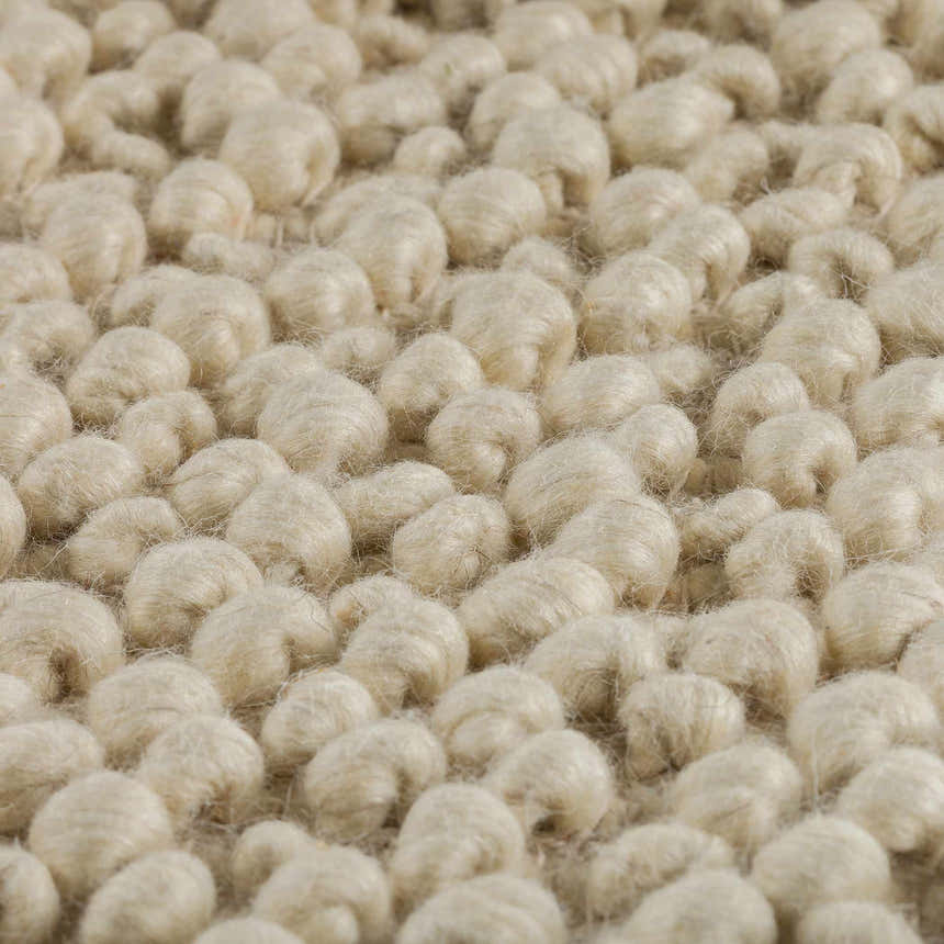 Close-up of the Dalyn Gorbea GR1 Vanilla Area Rug showing its chunky, hand-loomed texture and neutral vanilla color.
