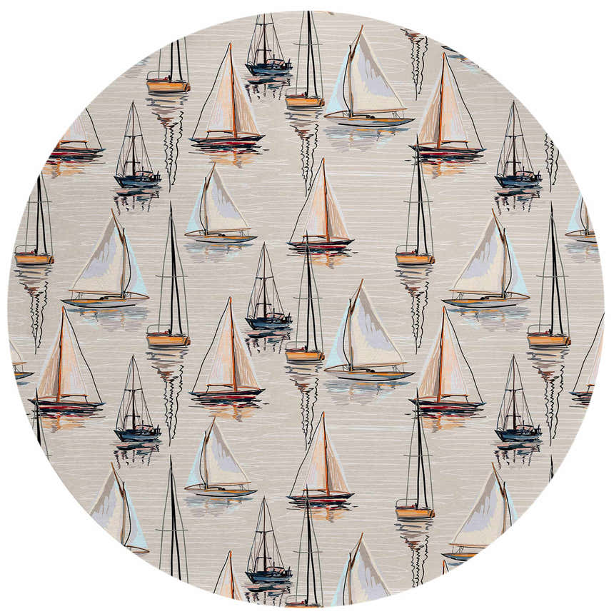 Close-up of round Dalyn Harbor HA8 Ivory Washable Area Rug featuring a sailboat pattern in beige, black, and gold.