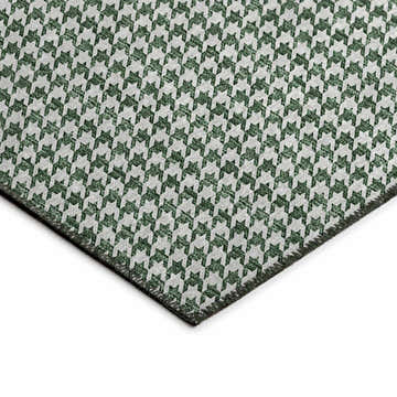 Close-up of Dalyn Hinton HN1 Green Washable Area Rug. Features a green and off-white houndstooth pattern and non-skid backing.
