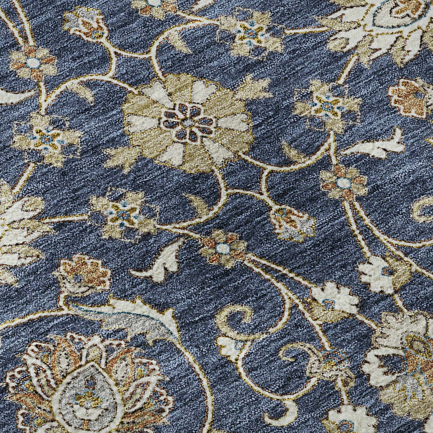 Close-up of the Dalyn Luxury Hatay HY1 Navy Washable Area Rug. Features a floral pattern in beige, caramel, and navy.