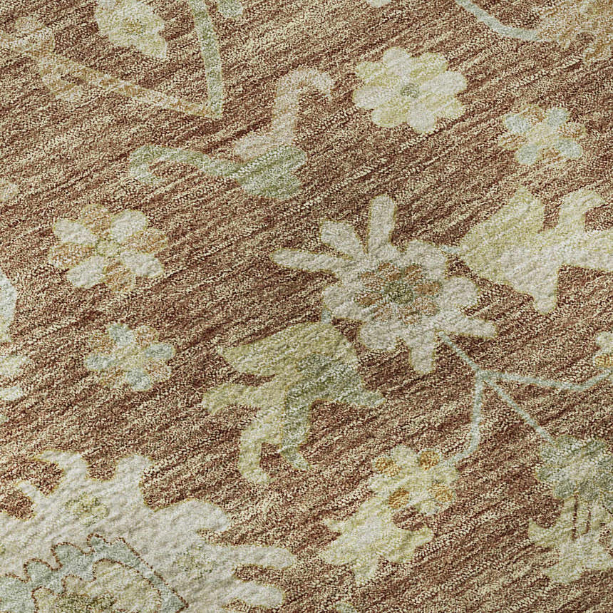 Close-up of Dalyn Luxury Hatay HY2 Paprika rug. Floral pattern in paprika, cream, and sage green. Machine-made texture.