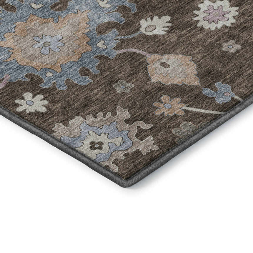 Close up of Dalyn Luxury Hatay HY4 Chocolate Washable Area Rug. Brown rug with beige, blush pink, and light blue floral pattern.