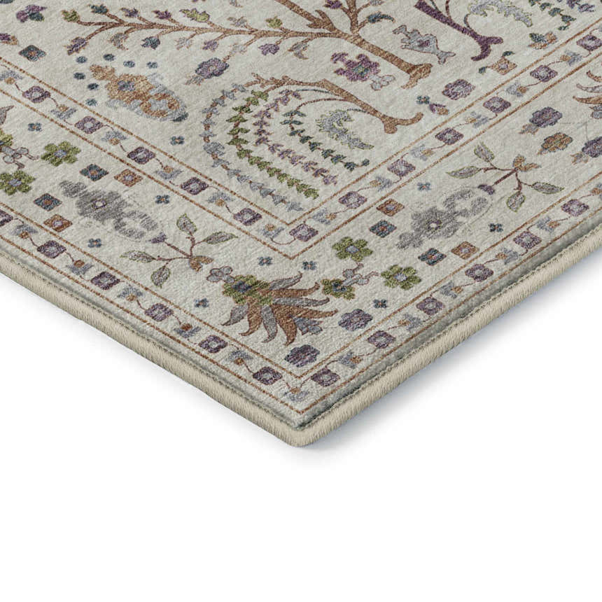 Close-up of the Dalyn Luxury Indoor/Outdoor Hatay HY5 Ivory Washable Area Rug. Features a farmhouse floral pattern with purple, green, and brown.