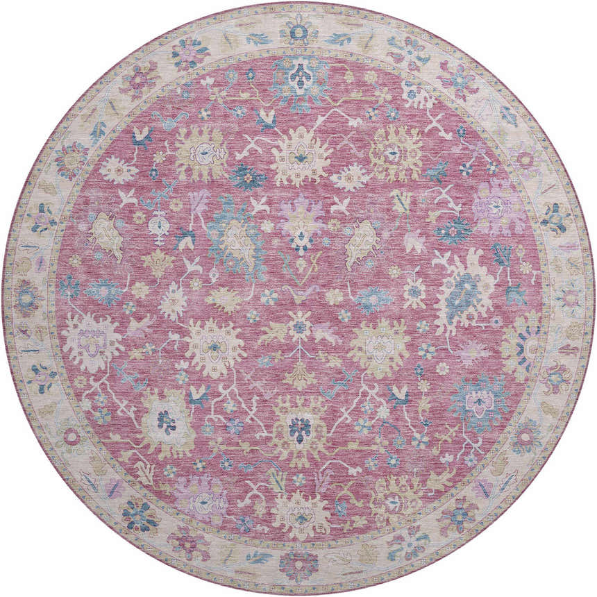 Close-up of the round Dalyn Luxury Hatay HY7 Pink Washable Area Rug with a traditional floral pattern in pink, beige, and blue.