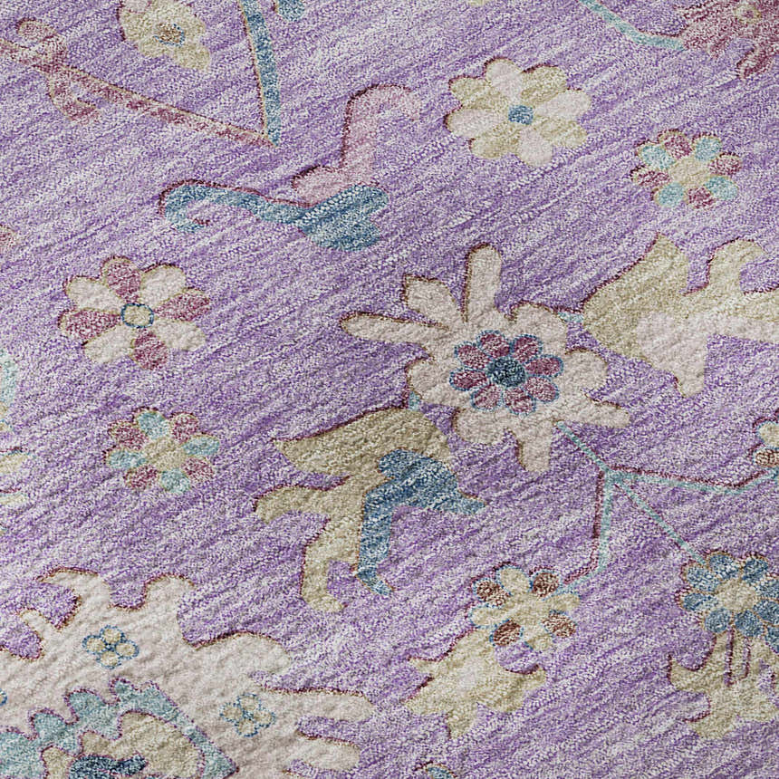 Close-up of the Dalyn Luxury Hatay HY7 Purple Washable Area Rug. Features a floral pattern in purple, beige, pink, and blue.