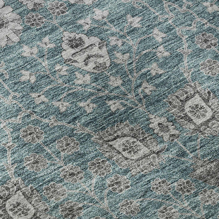 Close-up of Dalyn Luxury Hatay HY8 Teal Washable Area Rug. Features a traditional floral pattern in teal, gray, and taupe.