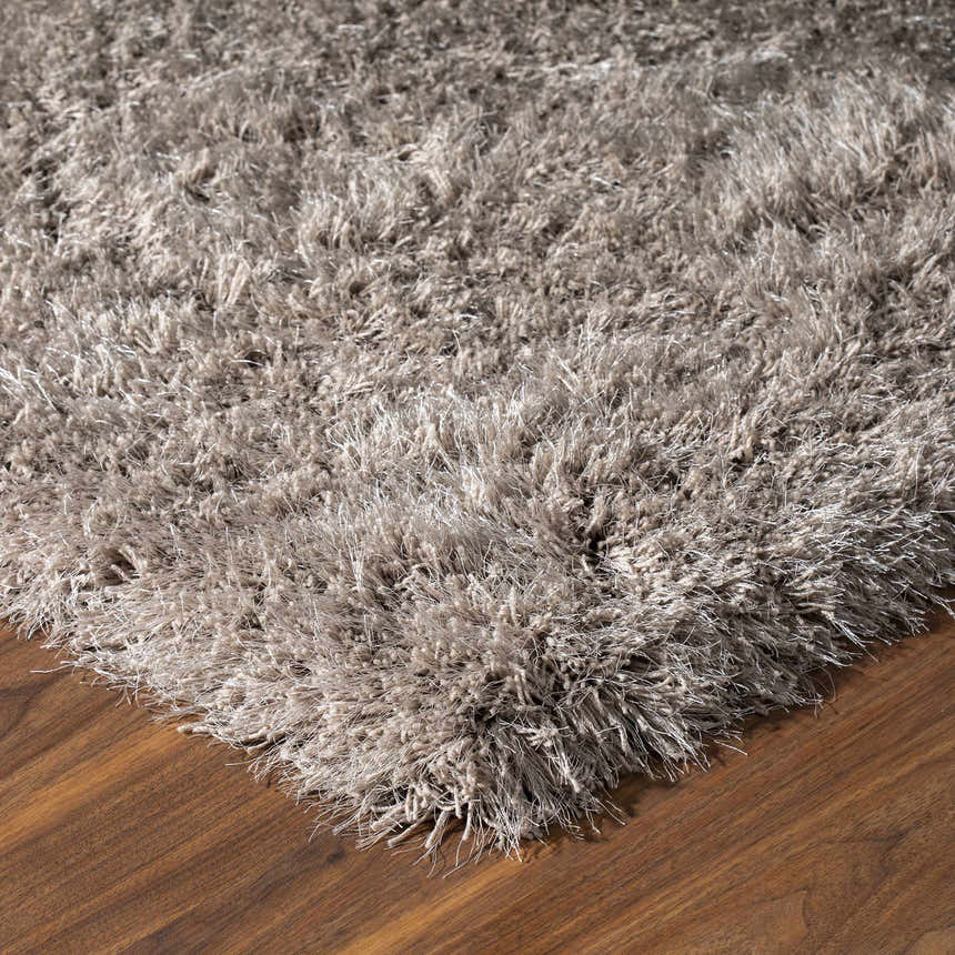 Close-up of the plush Dalyn Impact IA100 Mushroom Area Rug showing its shag texture and neutral mushroom color.