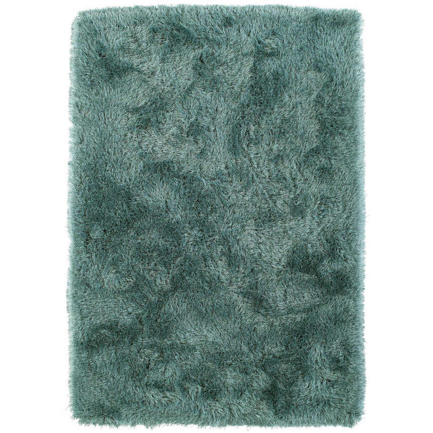 Close-up of the plush texture and teal color of the Dalyn Impact IA100 shag rug.