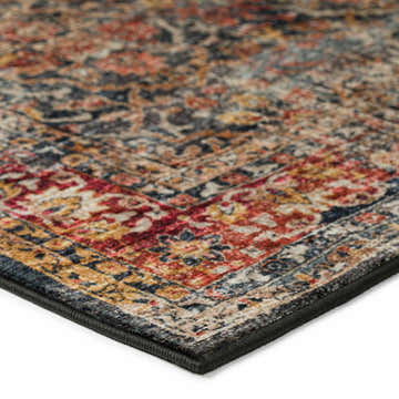 Close-up of the Dalyn Jericho JC3 Charcoal Area Rug. Features gold, red, spice, and taupe colors with a traditional pattern.