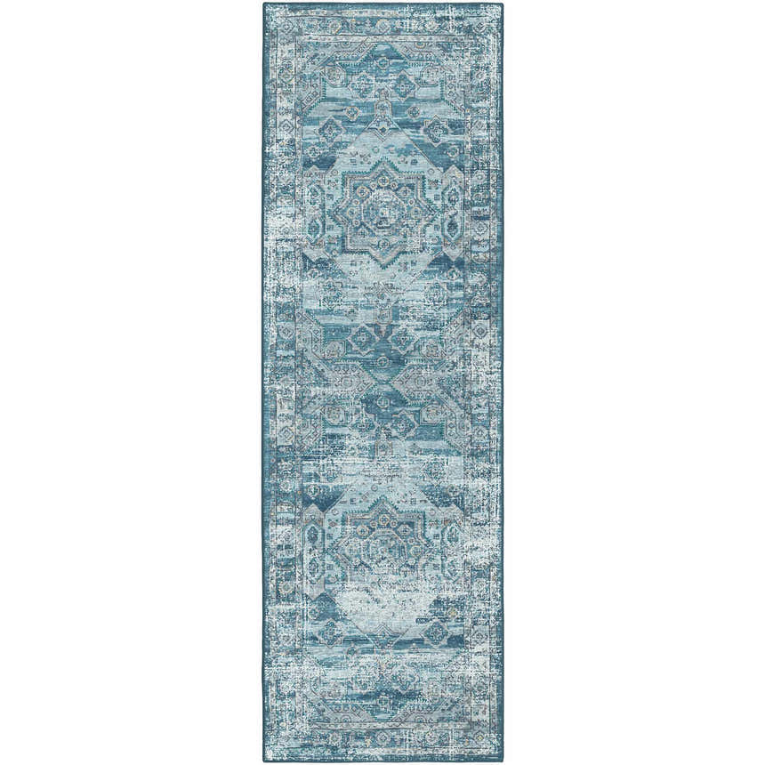 Close-up of a denim blue Dalyn Indoor/Outdoor Jericho JC5 runner rug with a traditional, distressed geometric pattern.