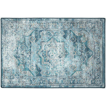 Close-up of the Dalyn Indoor/Outdoor Jericho JC5 Denim Area Rug. Features a traditional, distressed pattern in shades of denim, teal, and gray.
