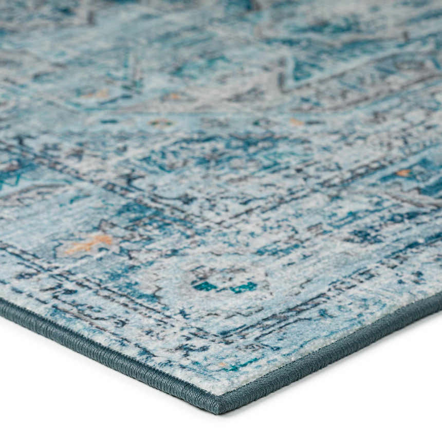 Close up of the Dalyn Jericho JC5 Denim Area Rug showing its traditional blue and gray pattern and texture.