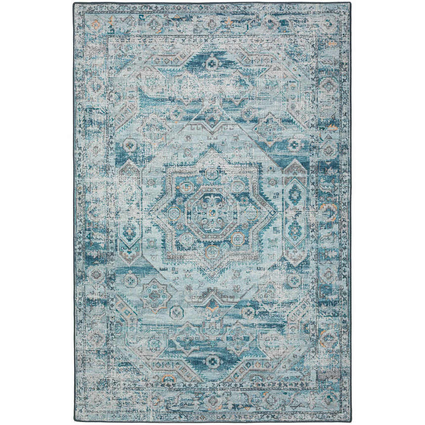 Close-up of the Dalyn Indoor/Outdoor Jericho JC5 Denim Area Rug. Features a traditional, distressed geometric pattern in denim and teal.