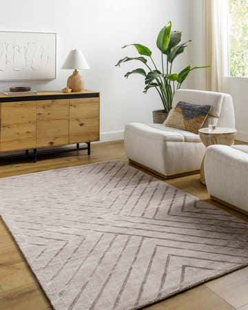 Living room scene with neutral armchairs and a Tavran Taupe subtle linear texture area rug. Roomscene-Rectangle
