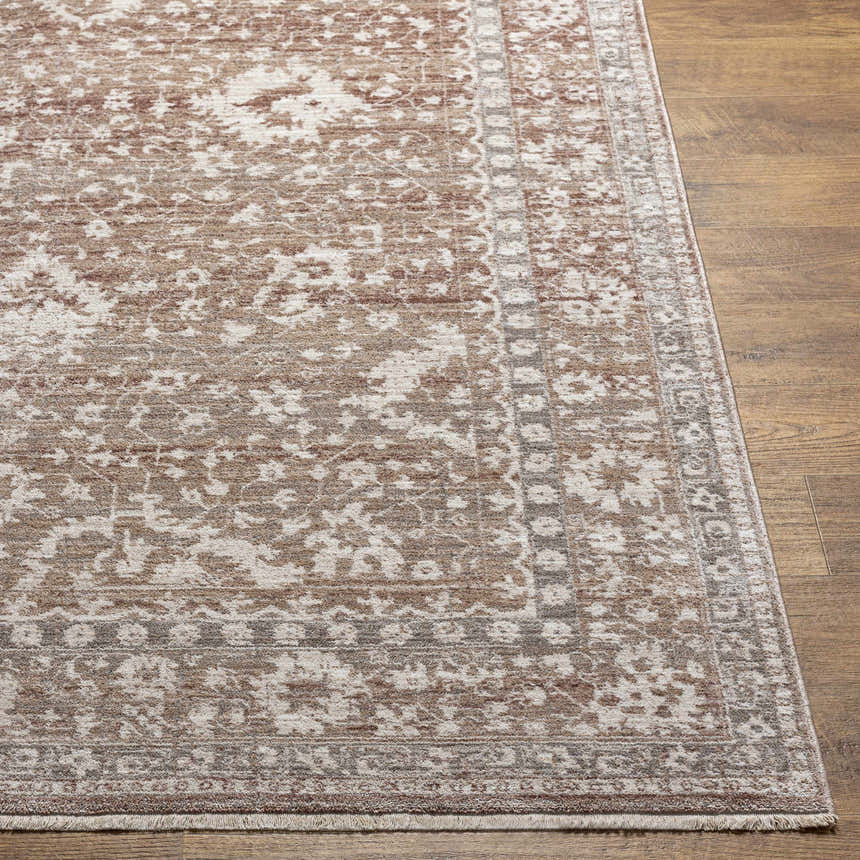 Close-up of the Kaongkod Area Rug, showcasing its traditional, oriental design in dusty pink, ivory, and brown tones on wood floor. Front
