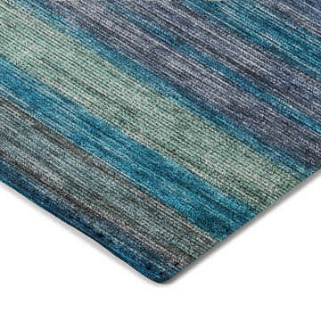 Close-up of the Dalyn Luxury Kochi KC5 Blue Area Rug, showing denim, teal, and green striped pattern and texture.
