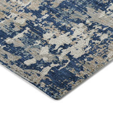 Close-up of Dalyn Luxury Kochi KC7 Navy Area Rug. Abstract pattern in navy, silver gray, and taupe.