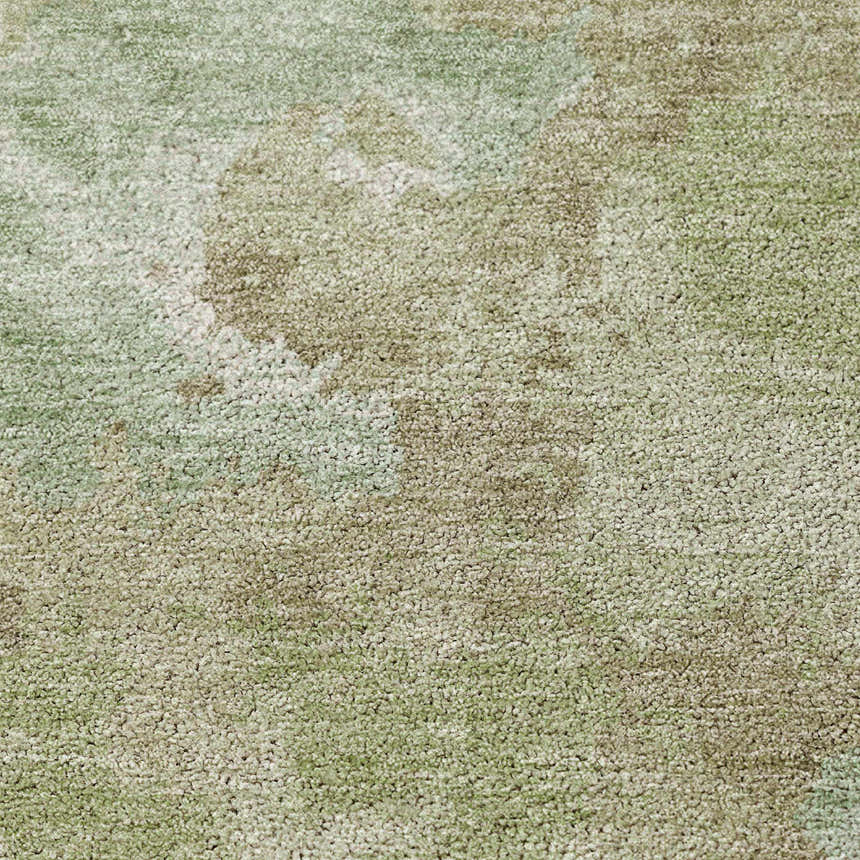 Close-up of the Dalyn Luxury Kochi KC9 Aloe Area Rug, showing its aloe, beige, and ivory textured pattern.