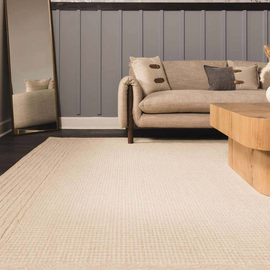 Living room scene with beige sofa, wood table, and ivory Kayoko wool area rug. Roomscene-Rectangle