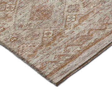 Close-up of the Dalyn Karaj KJ4 Copper Washable Area Rug. Beige, caramel, paprika, and rust colors in a traditional pattern.