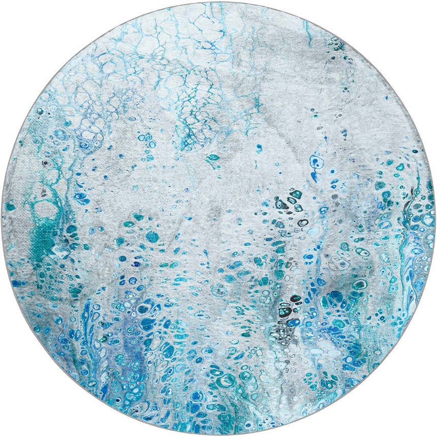 Close-up of round Dalyn Kikiamo KK18 Ocean Washable Area Rug. Light blue, ocean, and teal abstract pattern.