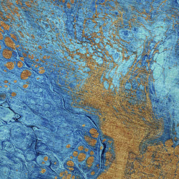 Close-up of Dalyn Machine Kikiamo KK8 Bermuda Washable Area Rug featuring blue, caramel, and navy marbled design.