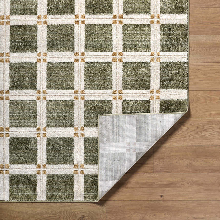 Close-up of Kalkin Olive Area Rug featuring a contemporary olive, cream, and gold grid pattern on a wood floor. Fold