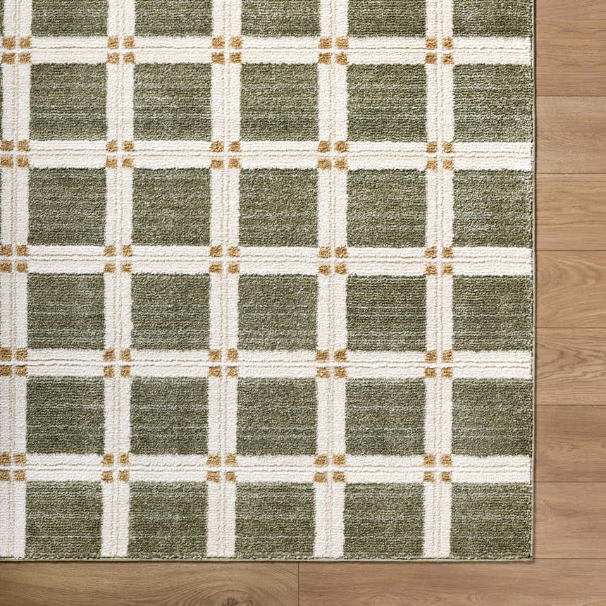 Close up of Kalkin Olive Area Rug featuring a contemporary olive, cream, and tan grid pattern. Corner