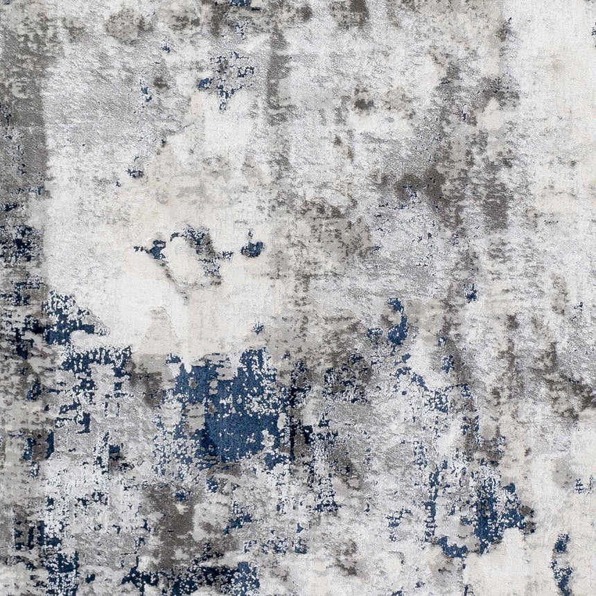 Close-up of Livabliss Aisha Surya AIS-2314 area rug. Abstract pattern in blue, charcoal, light gray, and off-white. Swatch