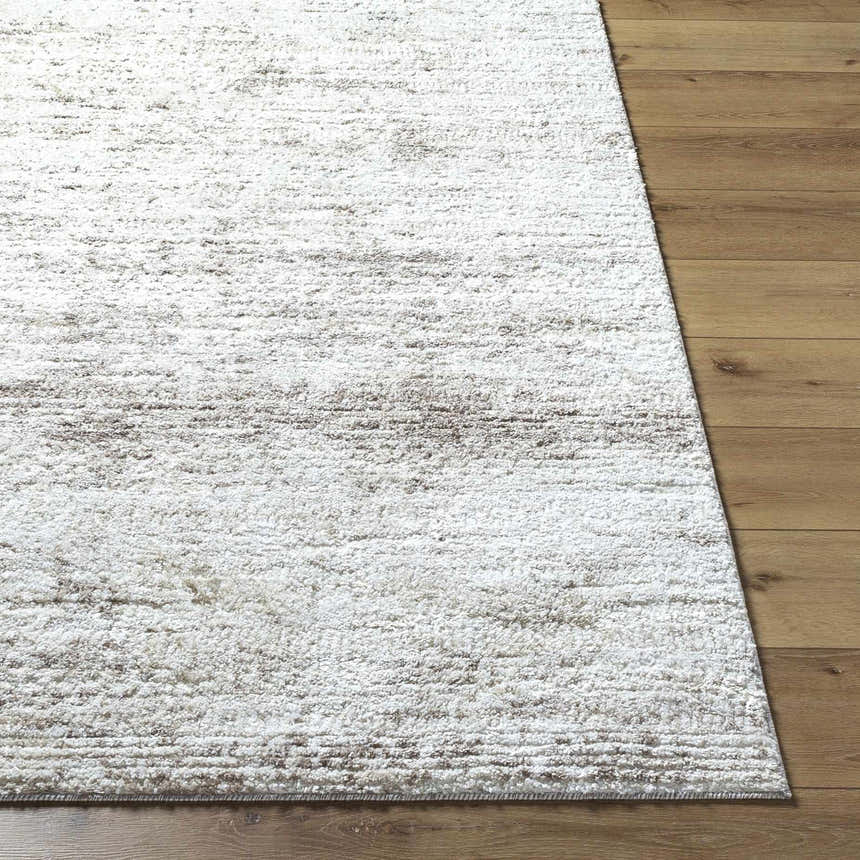 Close-up of the light gray Kohaku Area Rug showing its subtle beige, ivory, and tan horizontal pattern and soft texture. Front