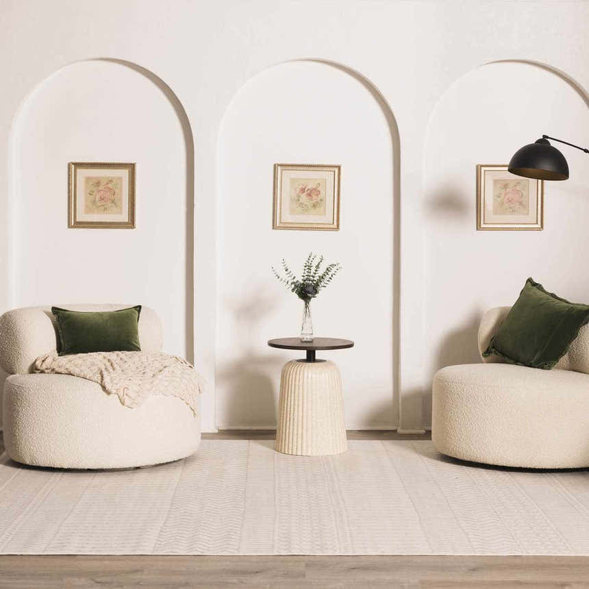 Living room scene with white chairs and Lascassas Neutral Area Rug. Bohemian, farmhouse style. Roomscene-Rectangle