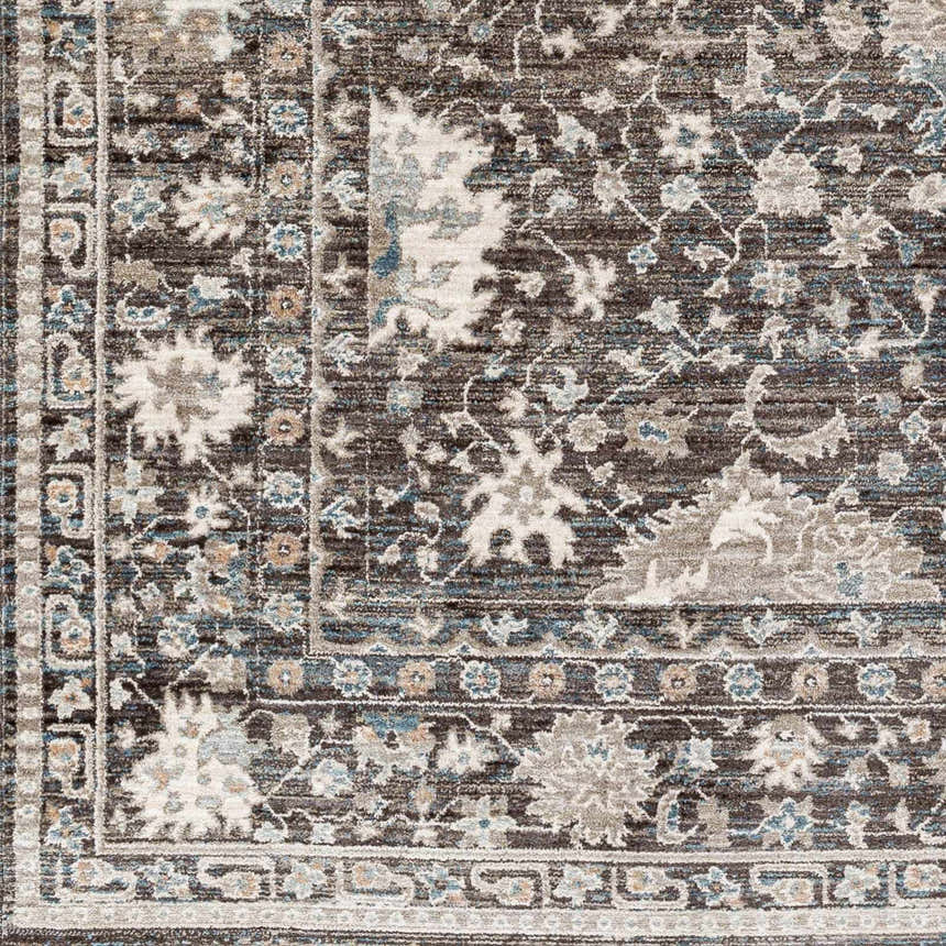 Close-up of the Linmansangan Area Rug featuring a traditional floral pattern in dark brown, ivory, and pale blue. Swatch