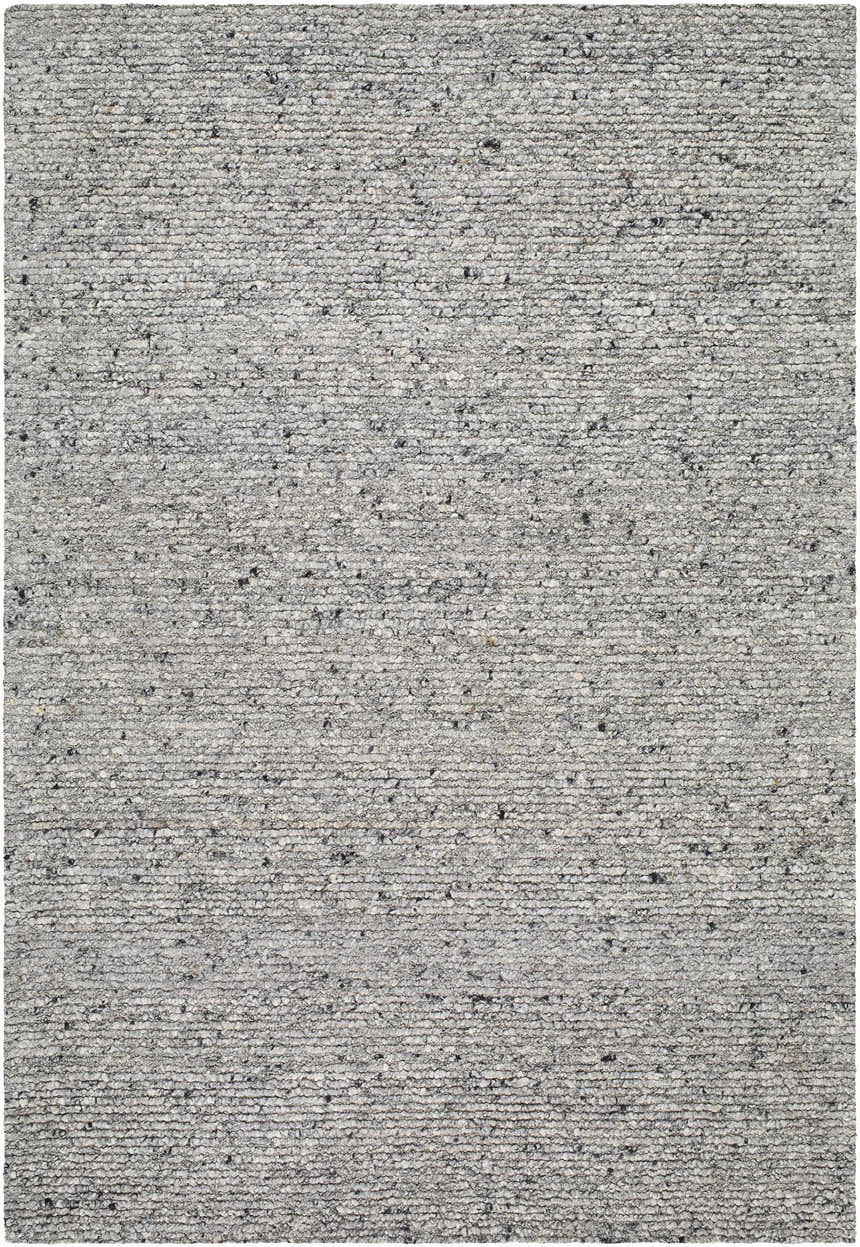 Close-up of the hand-tufted Winta Charcoal Wool Area Rug. Ash, gray, sage, and silver gray tones with subtle texture. Design-Rectangle-537