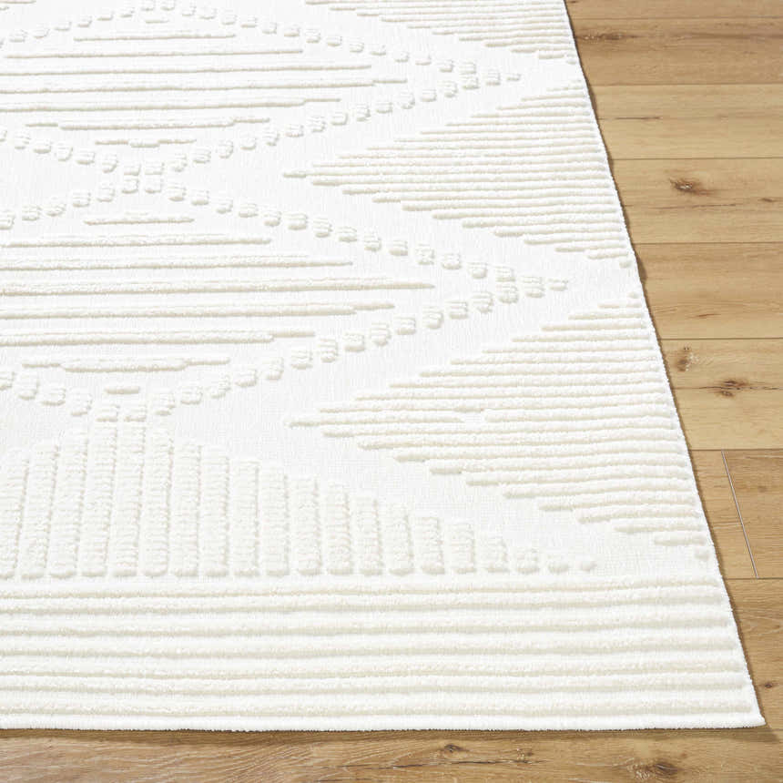 Close-up of the Annika Beige 3D Washable Area Rug showing its textured, geometric pattern and soft, off-white color. Front