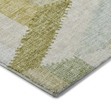 Close up of the Dalyn Luxury Lorenzo LN1 Aloe Washable Area Rug, showing green, gold, and beige tones and soft texture.