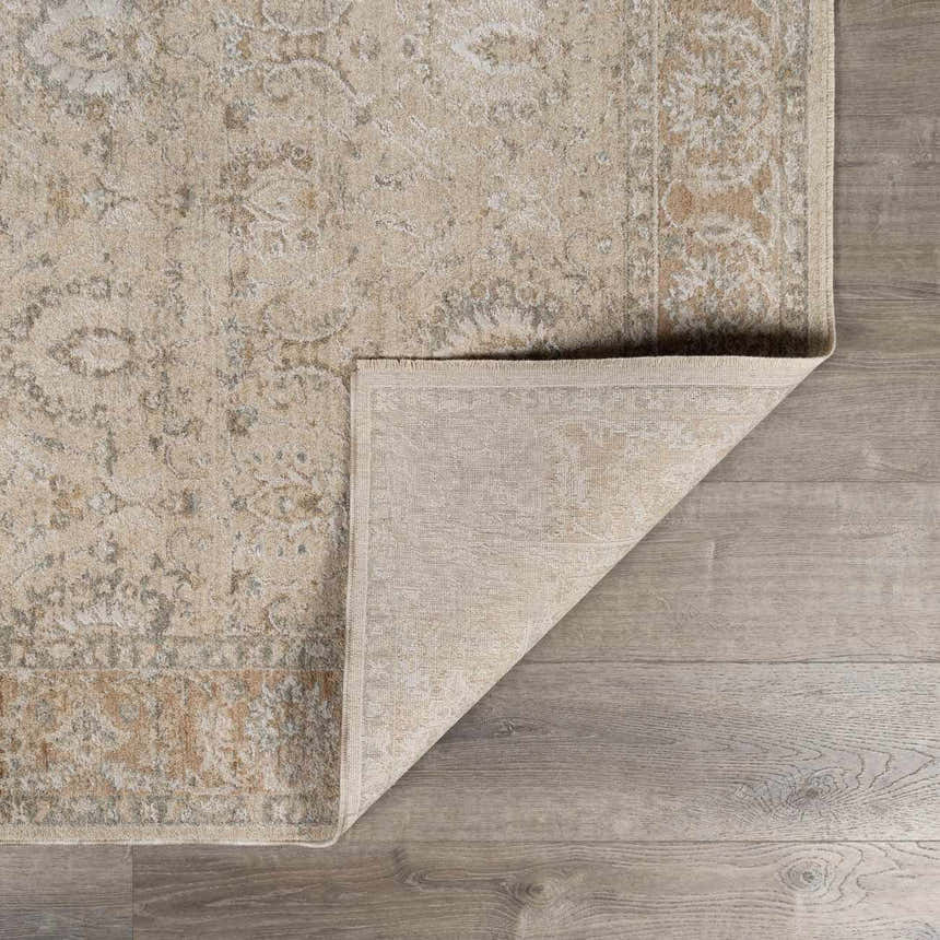 Close-up of the Airlia Cream Thick Luxe Area Rug showing its beige, ivory, and light gray traditional pattern and texture. Fold