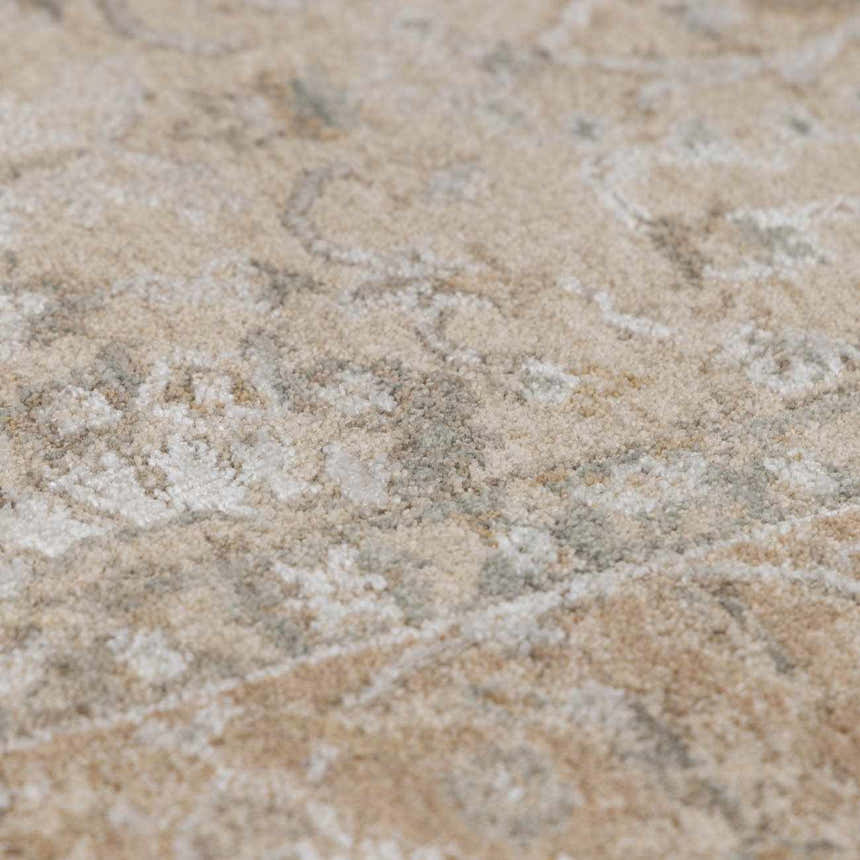 Close-up of the Airlia Cream Thick Luxe Area Rug showing its beige, ivory, and light gray traditional pattern and plush texture. Texture