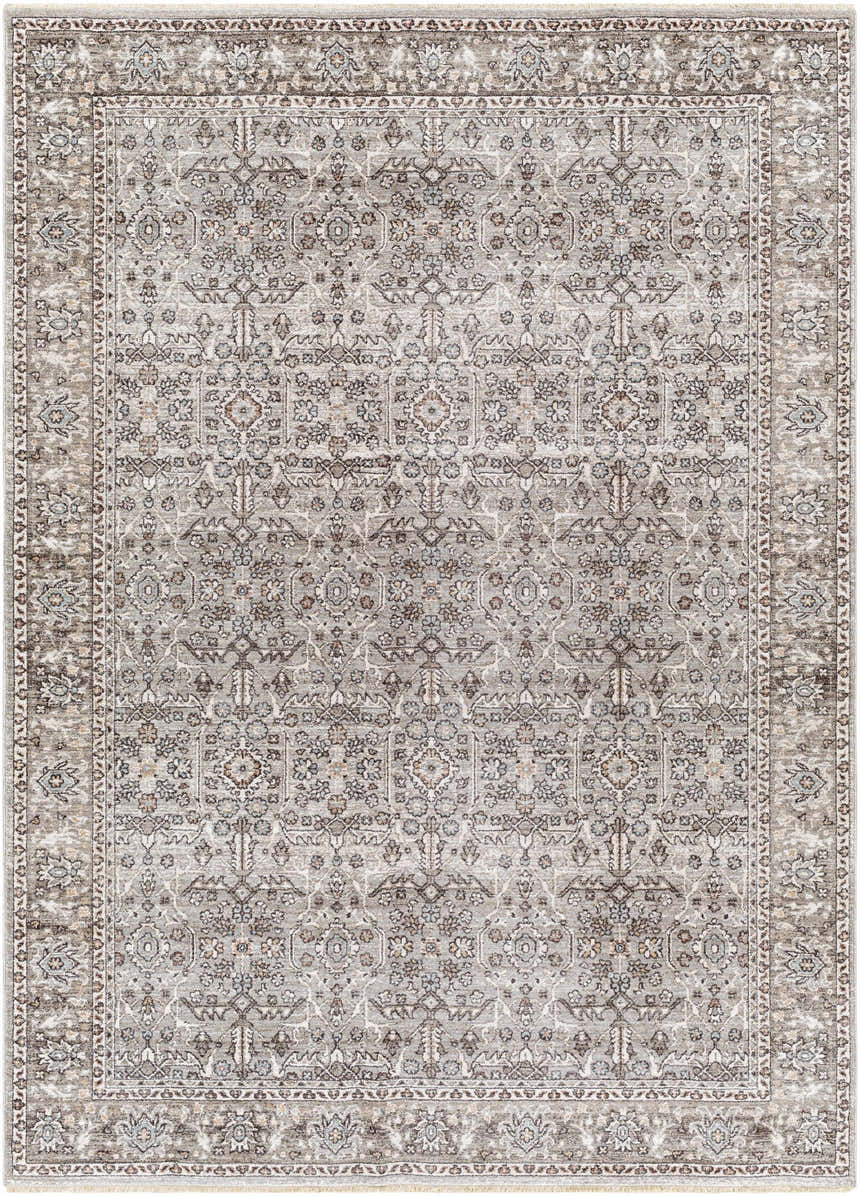 Detailed view of the Lugo Luxe Area Rug, a traditional rug with a charcoal and light gray floral pattern and tassel detail. Design-Rectangle-537
