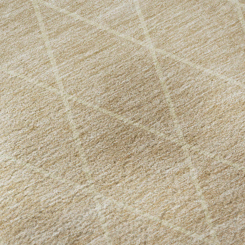 Close-up of the beige and salmon Dalyn Luxury Lazio rug, showing its subtle geometric pattern and textured weave.