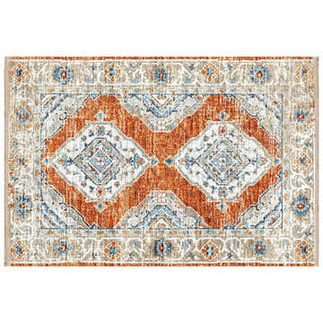 Close-up of Dalyn Marbella MB1 Spice Washable Area Rug. Features a traditional diamond pattern in chestnut, ivory, and blue tones.