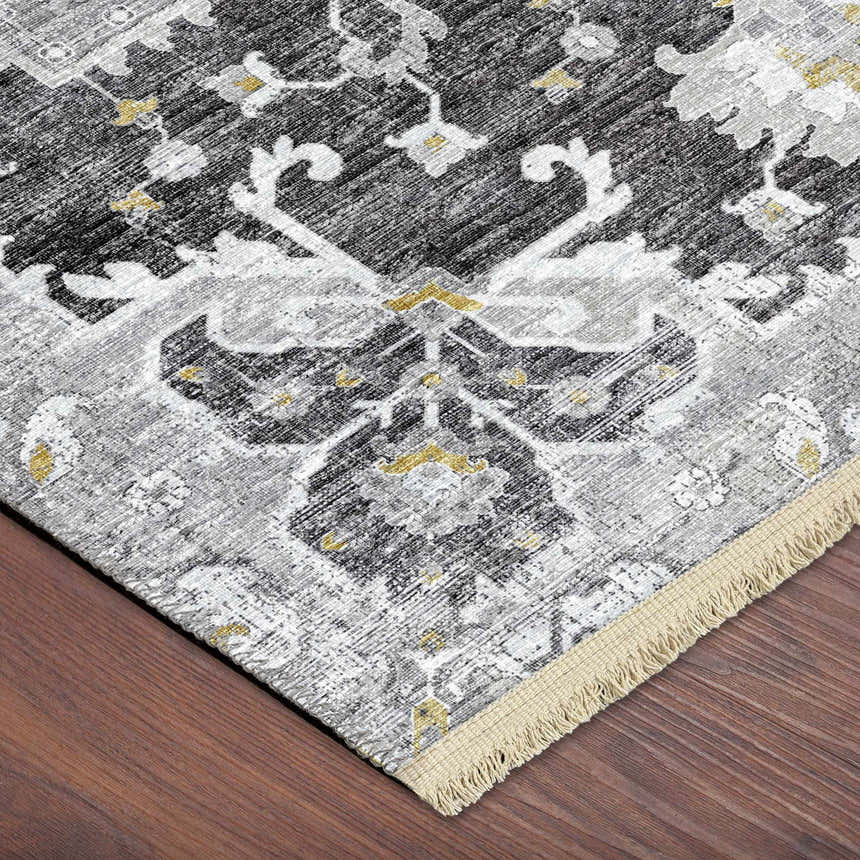 Close-up of Dalyn Marbella MB3 Midnight Washable Area Rug. Features traditional pattern, gold accents, gray, and fringe.