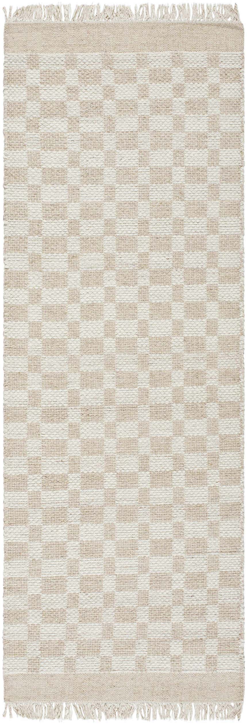 Close-up of the Meira Tan Area Rug, a hand-woven wool rug with a checkerboard pattern in ivory and tan, and fringed edges. Design-Runner-268