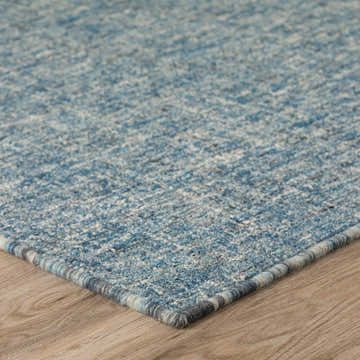 Close-up of the textured Dalyn Mateo ME1 Denim Area Rug. Features blue, denim, and off-white hues.
