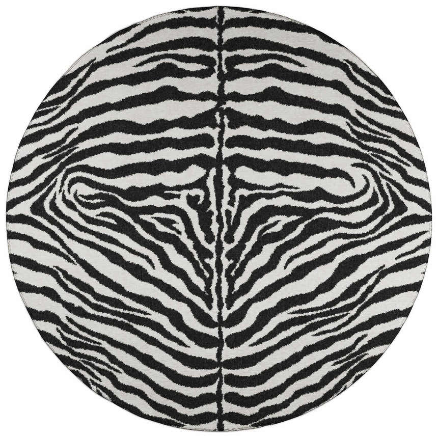 Close-up of round Dalyn Mali ML1 Ivory Washable Area Rug with a bold black and ivory zebra stripe pattern.