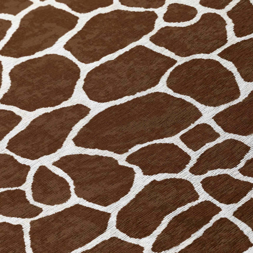 Close-up of the Dalyn Mali ML4 Chocolate Washable Area Rug, featuring a brown and white giraffe print pattern.
